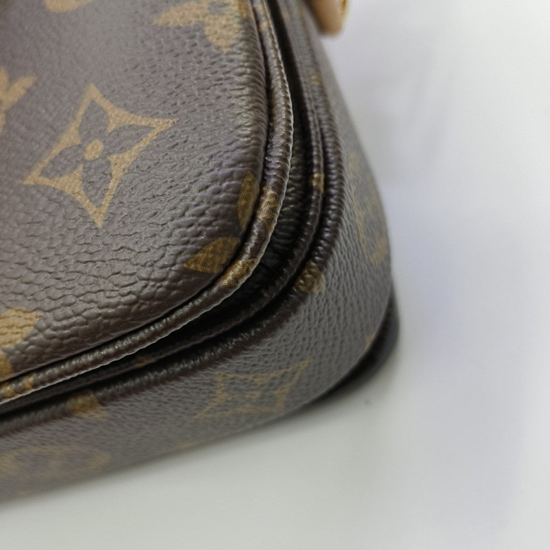 MÉTIS EAST WEST Monogram Coated Canvas Brown