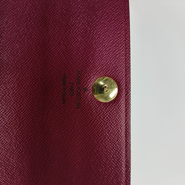 Monedero Monogram en lona revestida blanca