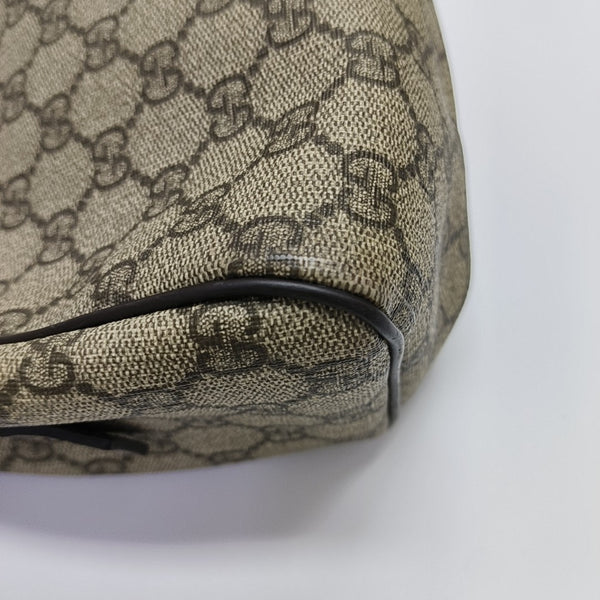 Monogram Coated Canvas Clutch Brown