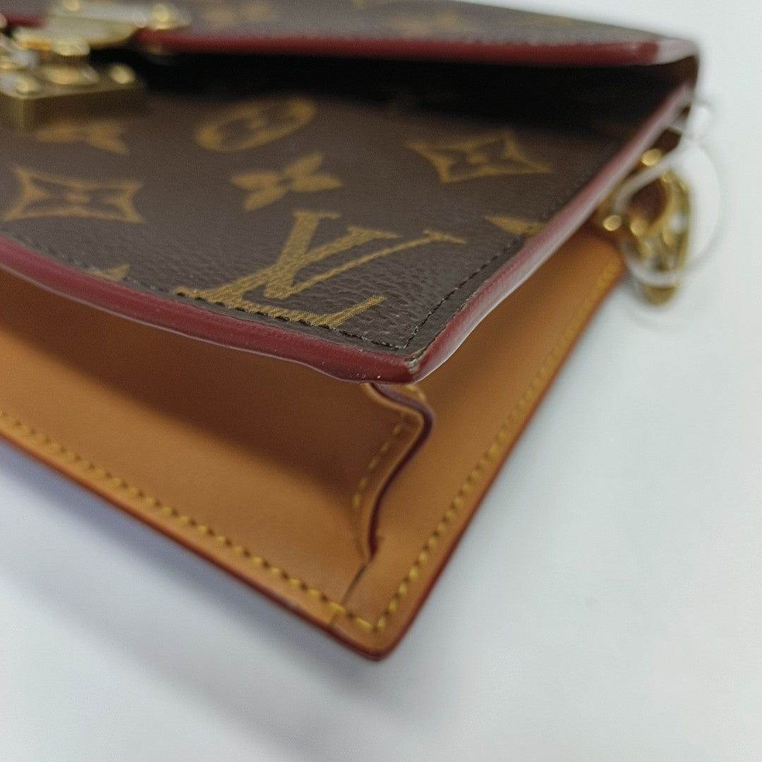 S LOCK Monogram Coated Canvas Brown