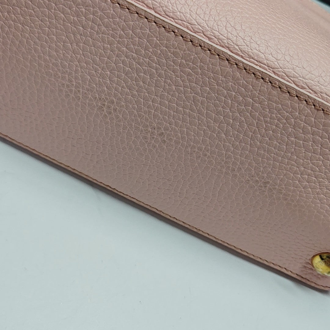 Authenticated pre-owned  CAPUCINES PM Calfskin Pink - Shoulder Bag at Looply