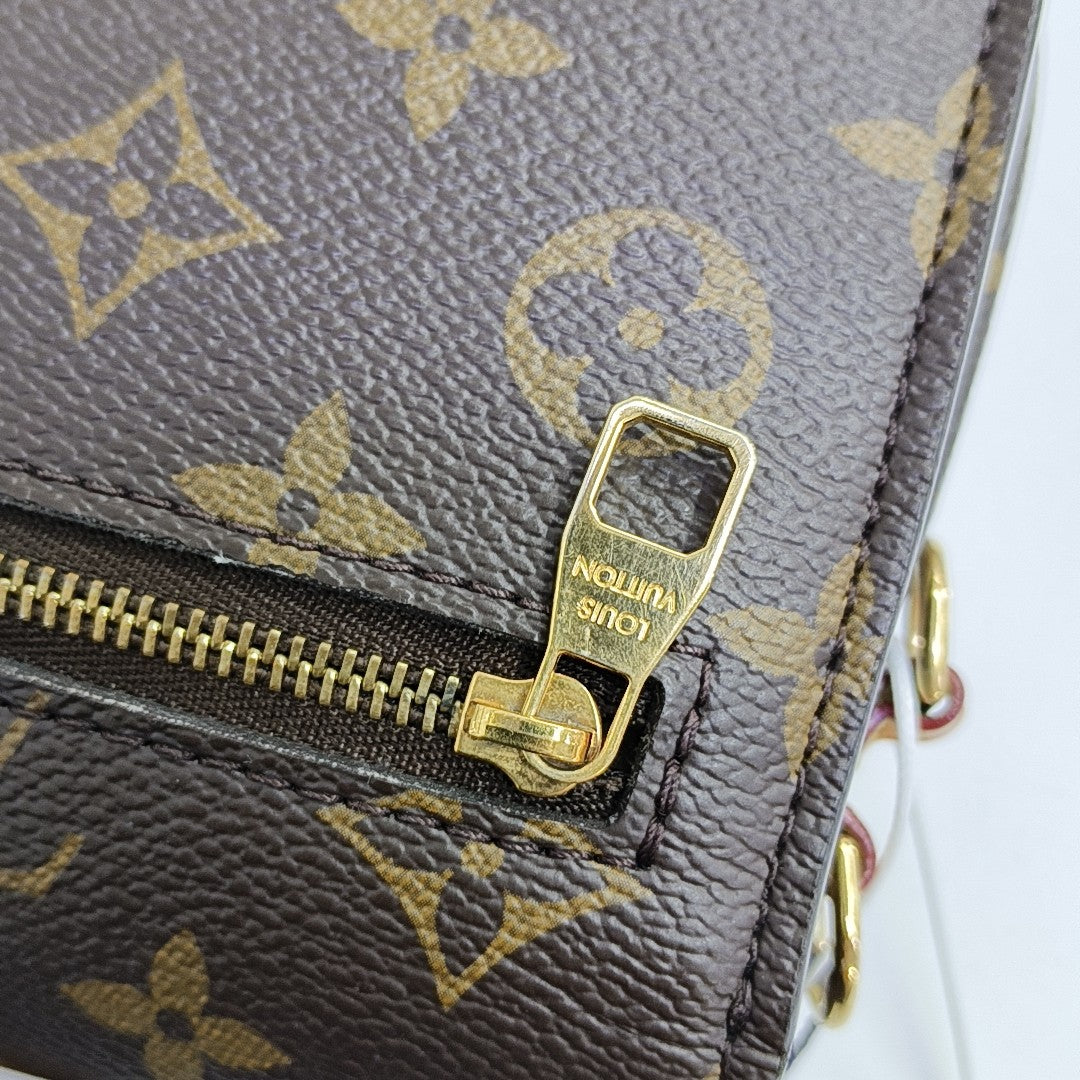 MÉTIS EAST WEST Monogram Coated Canvas Brown