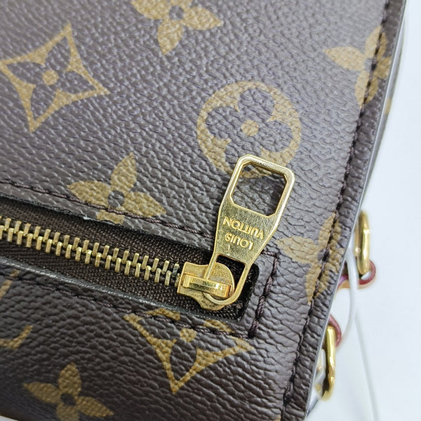 MÉTIS EAST WEST Monogram Coated Canvas Brown
