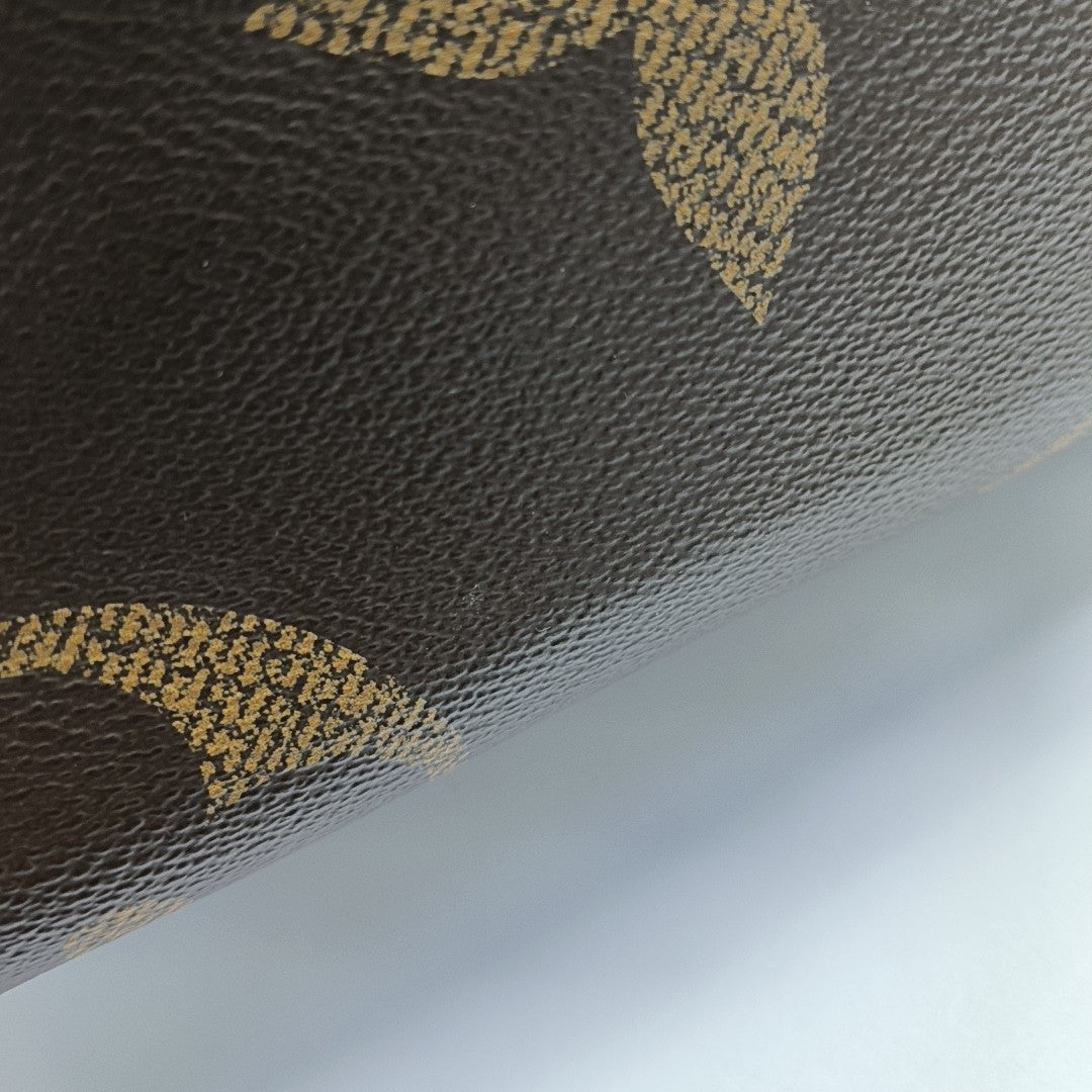 ONTHEGO GM Monogram Coated Canvas Brown