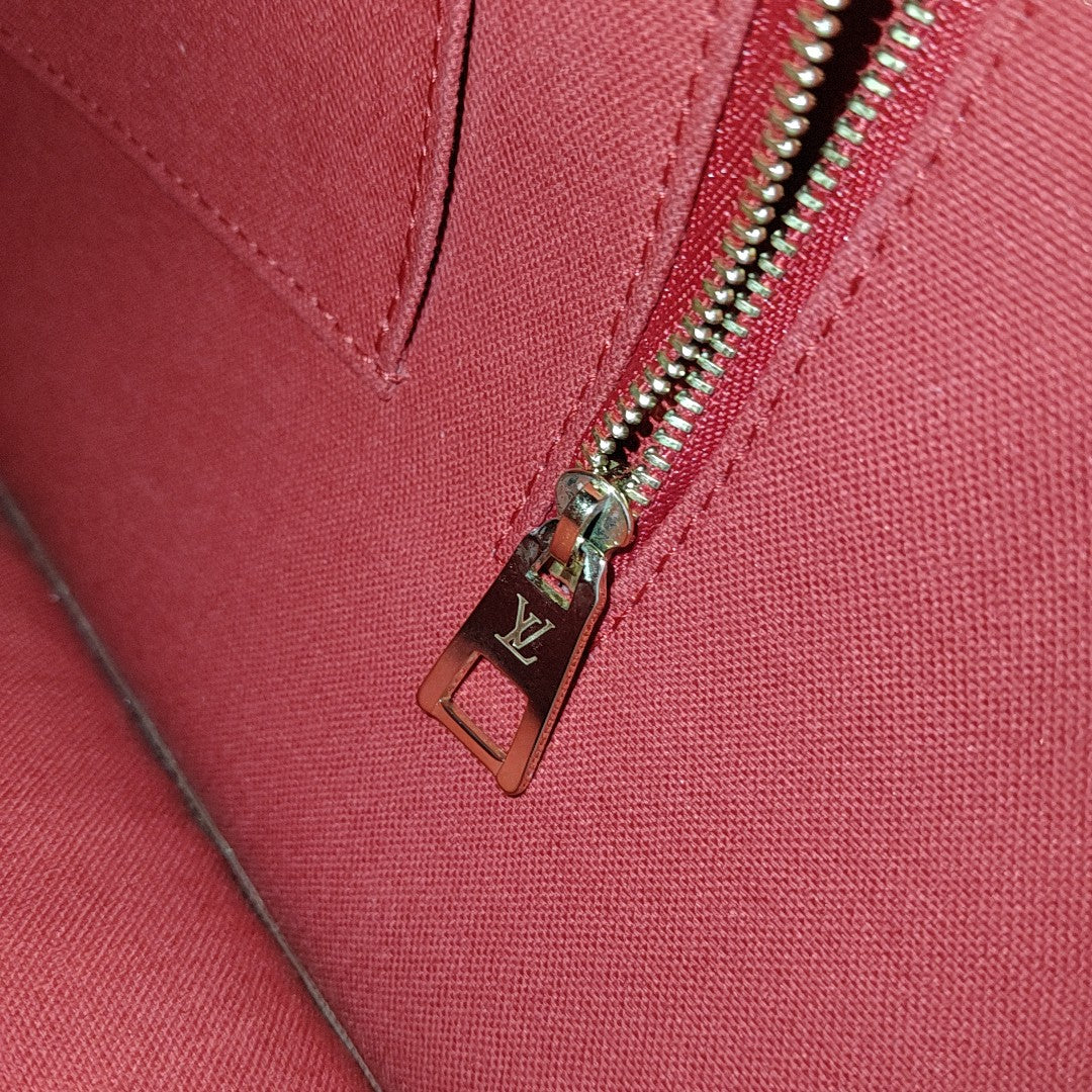 ONTHEGO MM Monogram Coated Canvas Brown