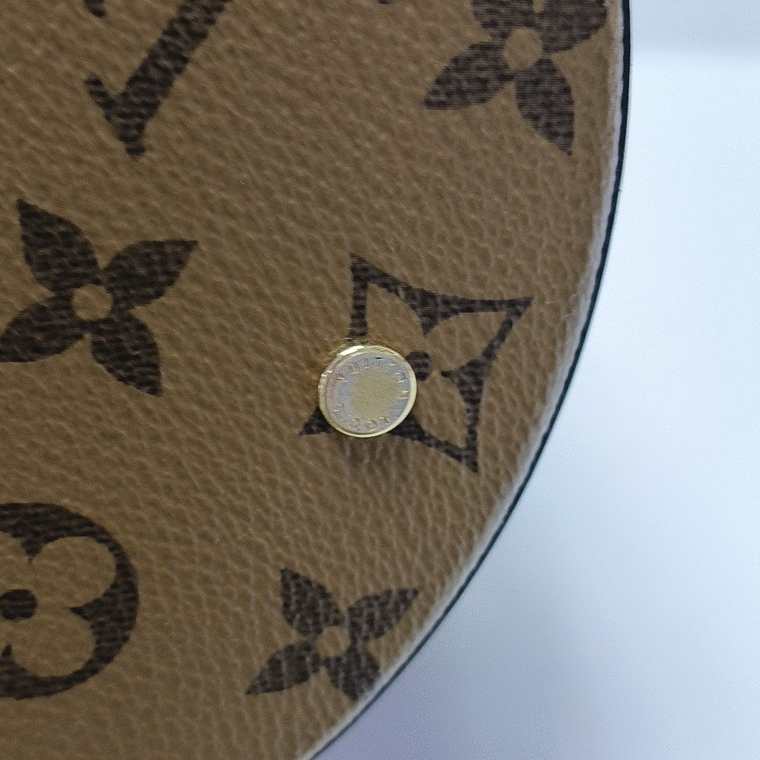 CANNES PM Monogram Coated Canvas Brown