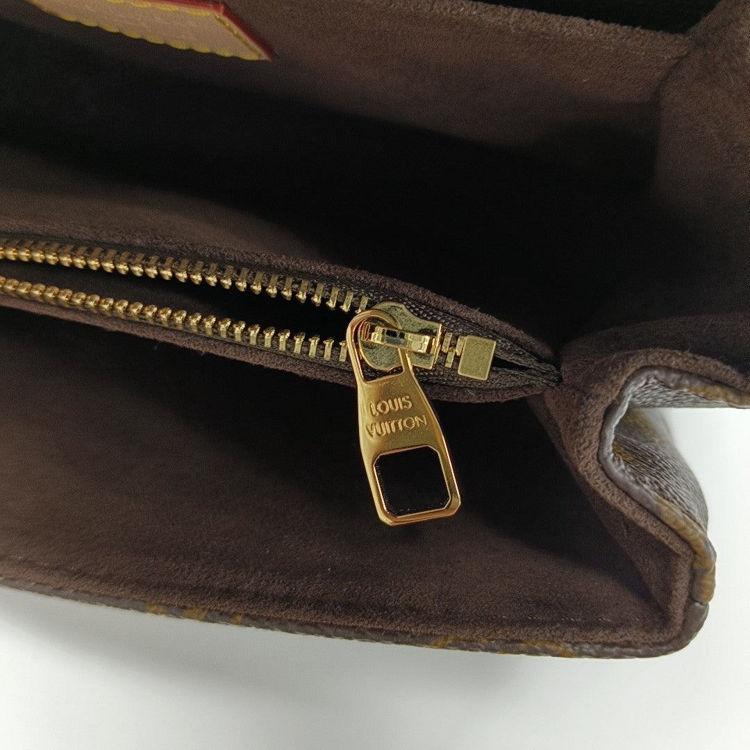 MÉTIS EAST WEST Monogram Coated Canvas Brown