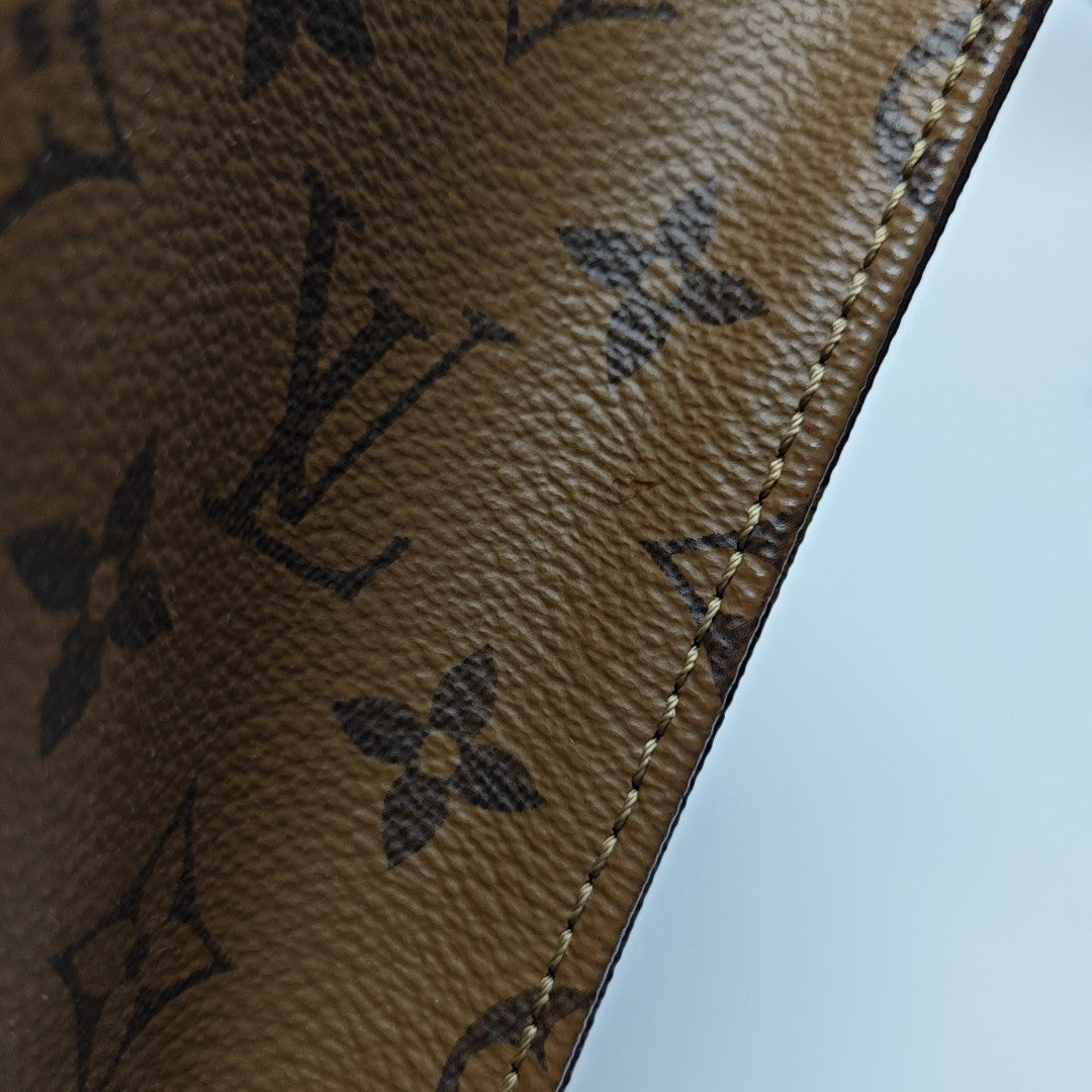 ONTHEGO MM Monogram Coated Canvas Brown
