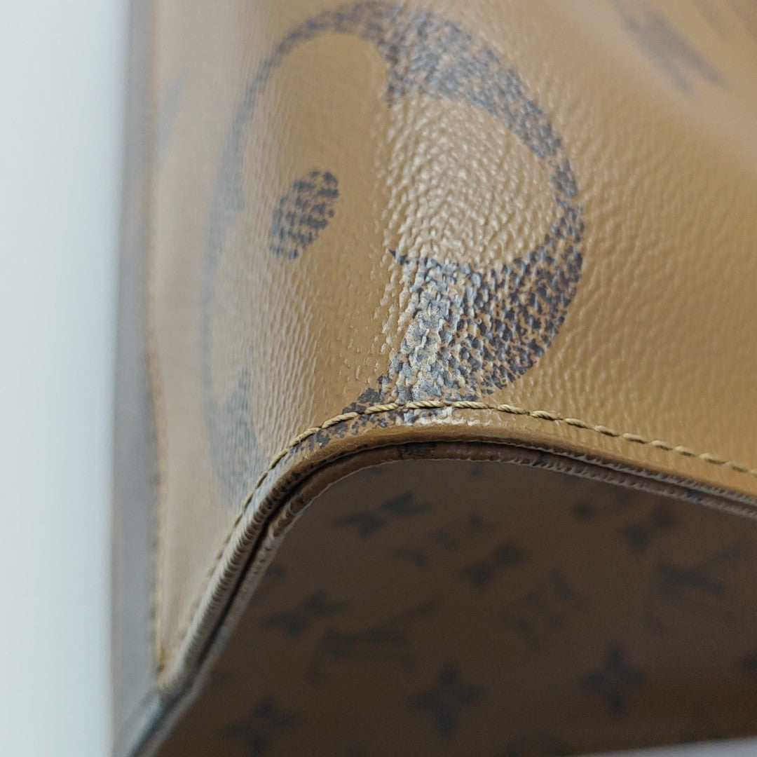 ONTHEGO MM Monogram Coated Canvas Brown