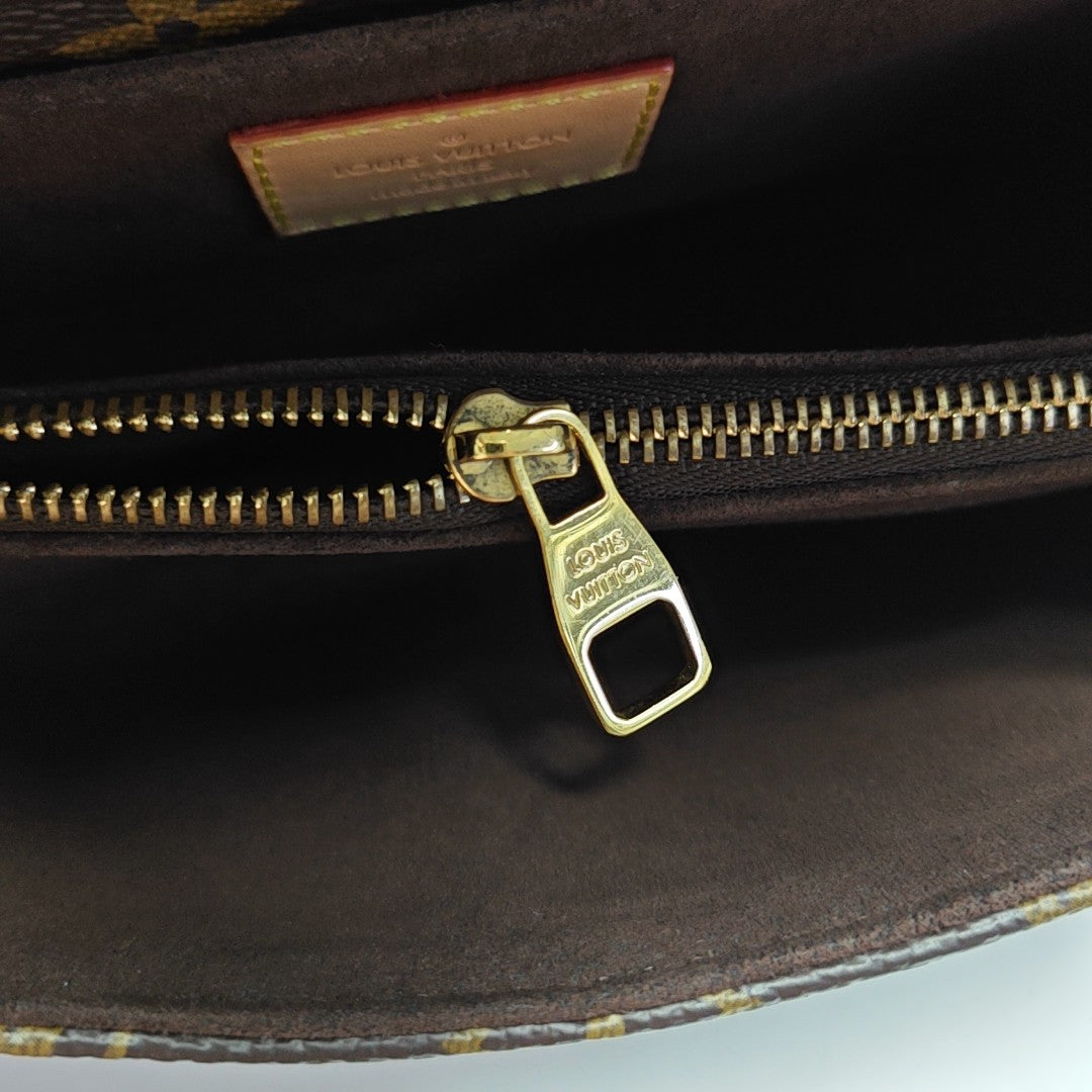 MÉTIS EAST WEST Monogram Coated Canvas Brown