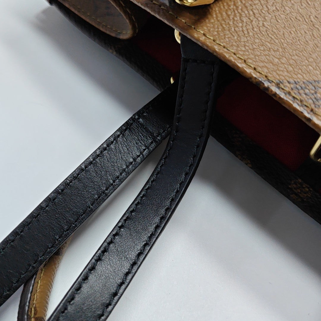 ONTHEGO MM Monogram Coated Canvas Brown