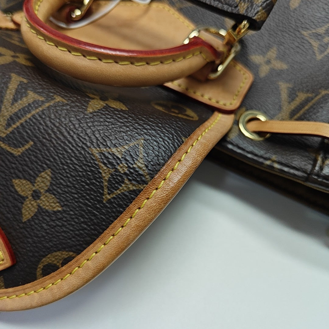 EXCURSION PM Monogram Coated Canvas Brown