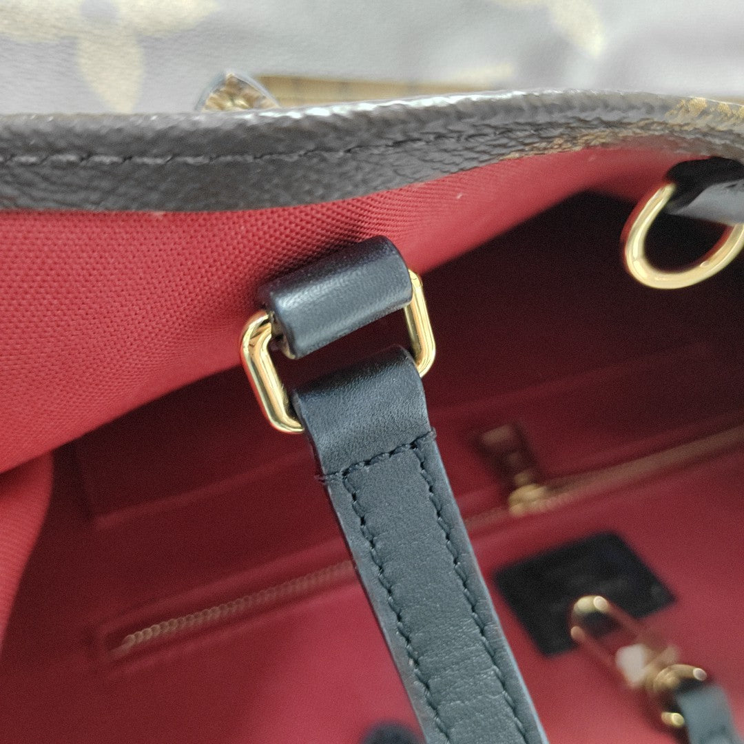 ONTHEGO MM Monogram Coated Canvas Brown