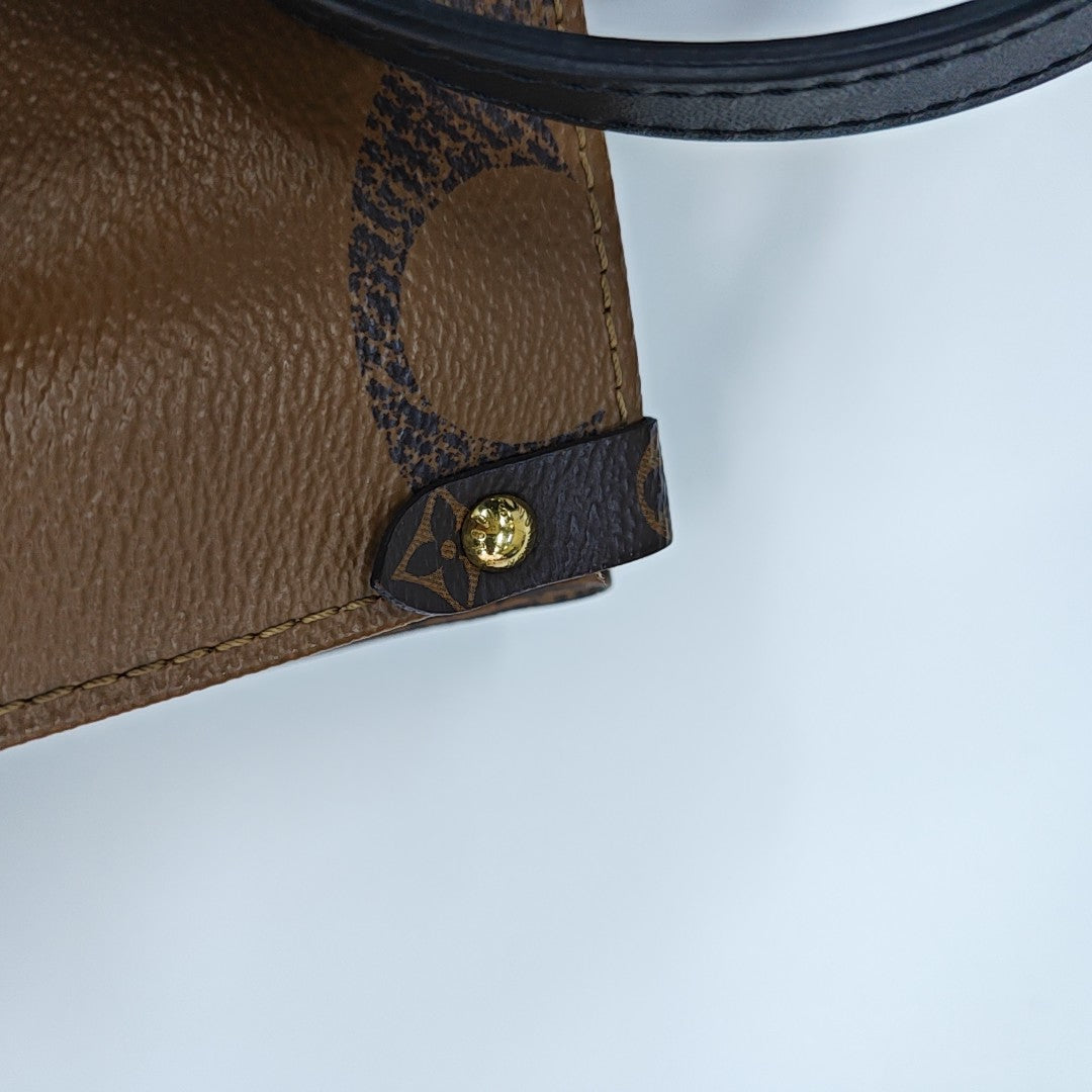 ONTHEGO MM Monogram Coated Canvas Brown