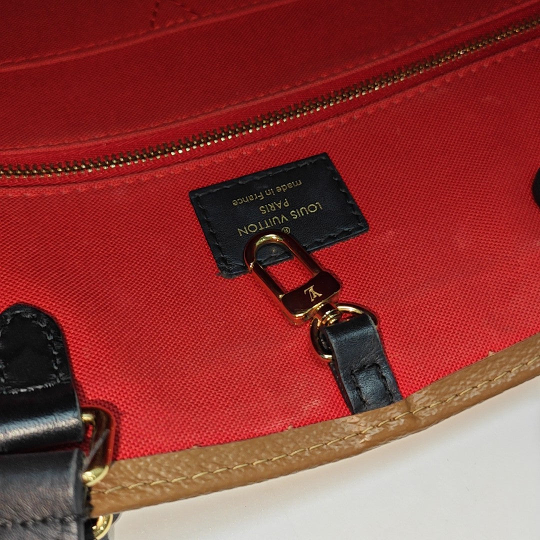 ONTHEGO GM Monogram Coated Canvas Brown