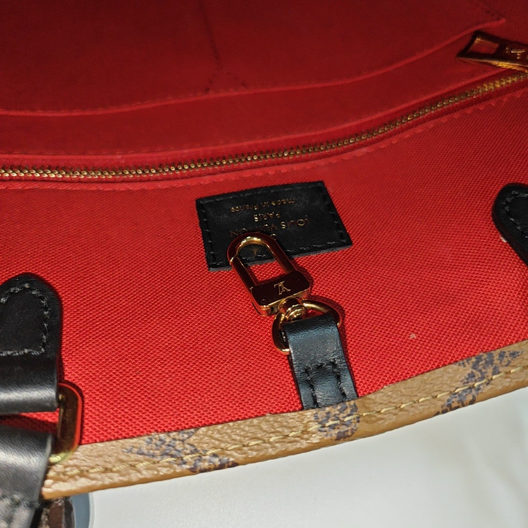 ONTHEGO MM Monogram Coated Canvas Brown