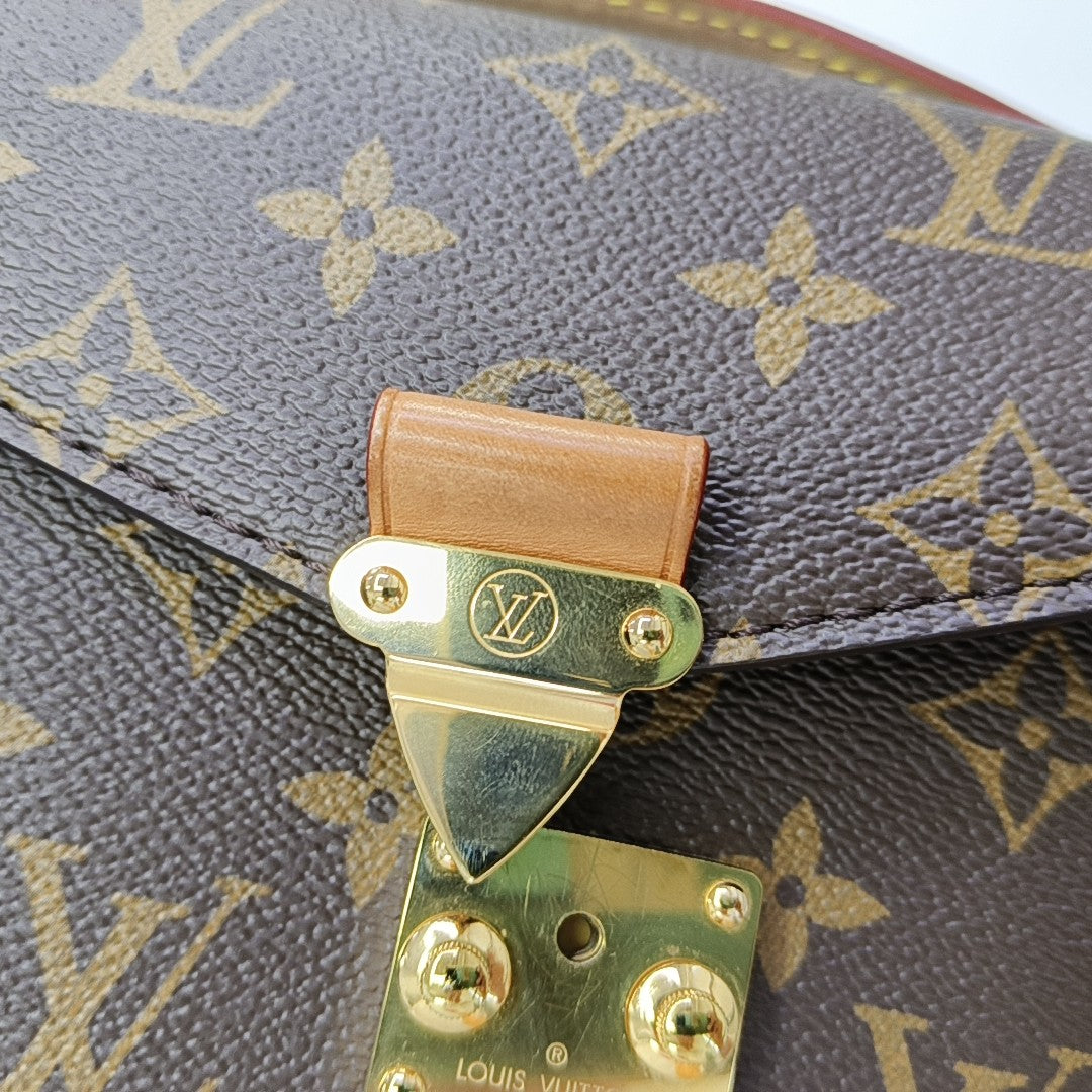 MÉTIS EAST WEST Monogram Coated Canvas Brown