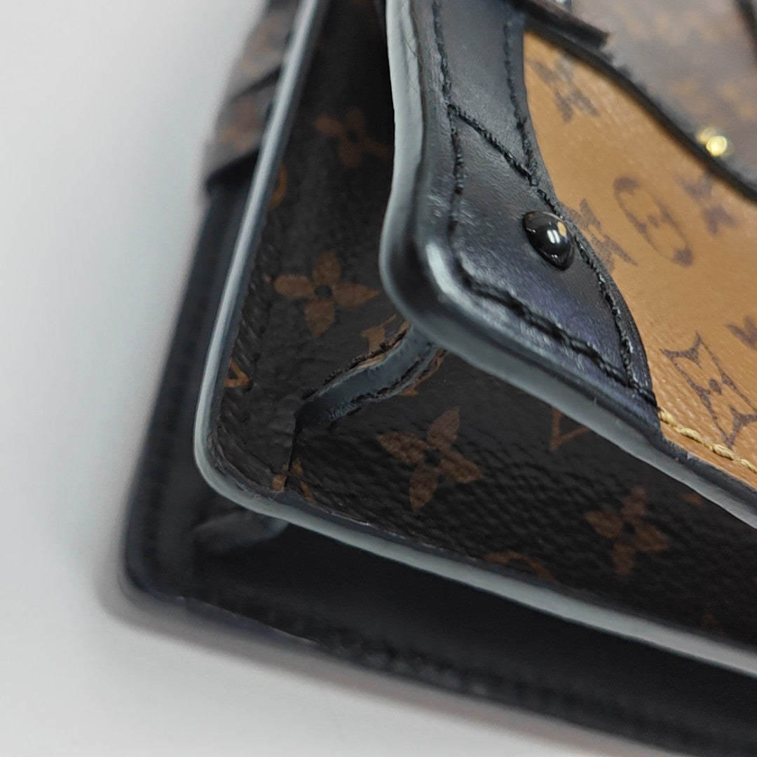 TRUNK Monogram Coated Canvas Brown