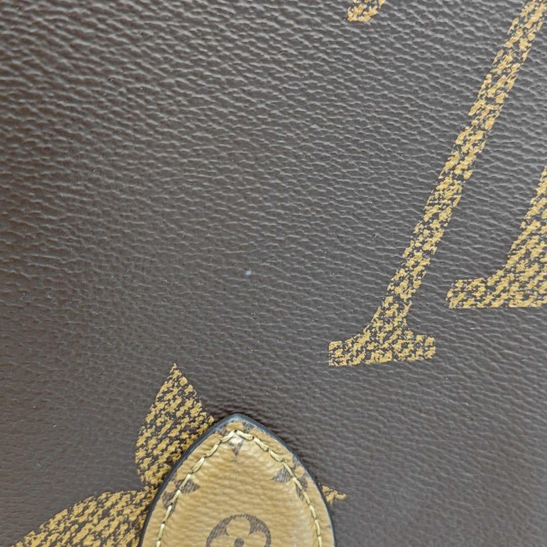 ONTHEGO MM Monogram Coated Canvas Brown