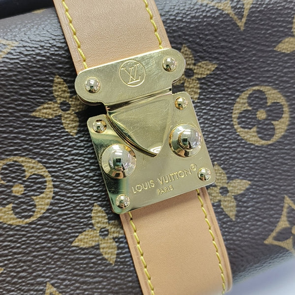 Pochette Mia Monogram Coated Canvas Brown