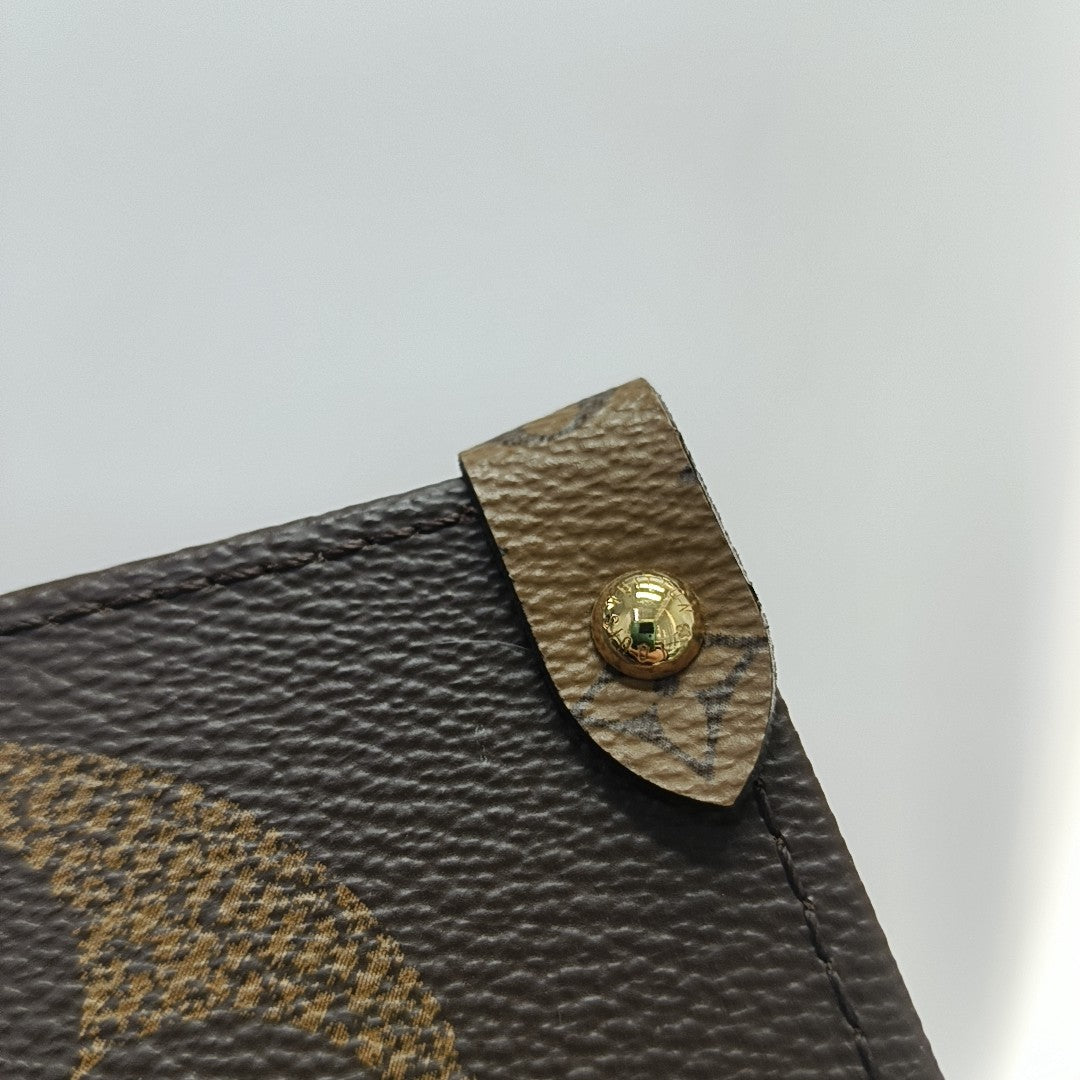 ONTHEGO GM Monogram Coated Canvas Brown