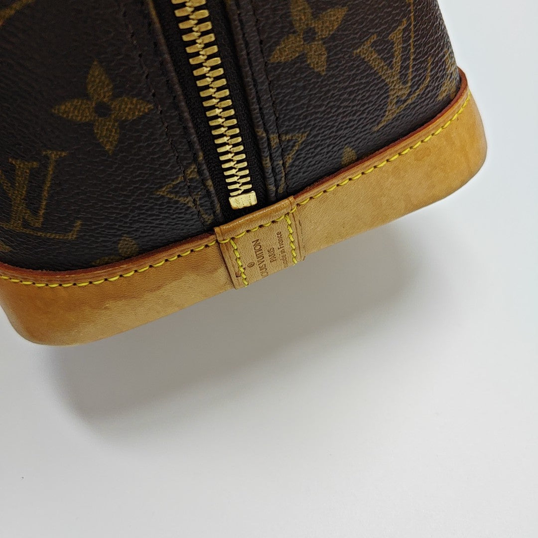 ALMA PM Monogram Coated Canvas Brown