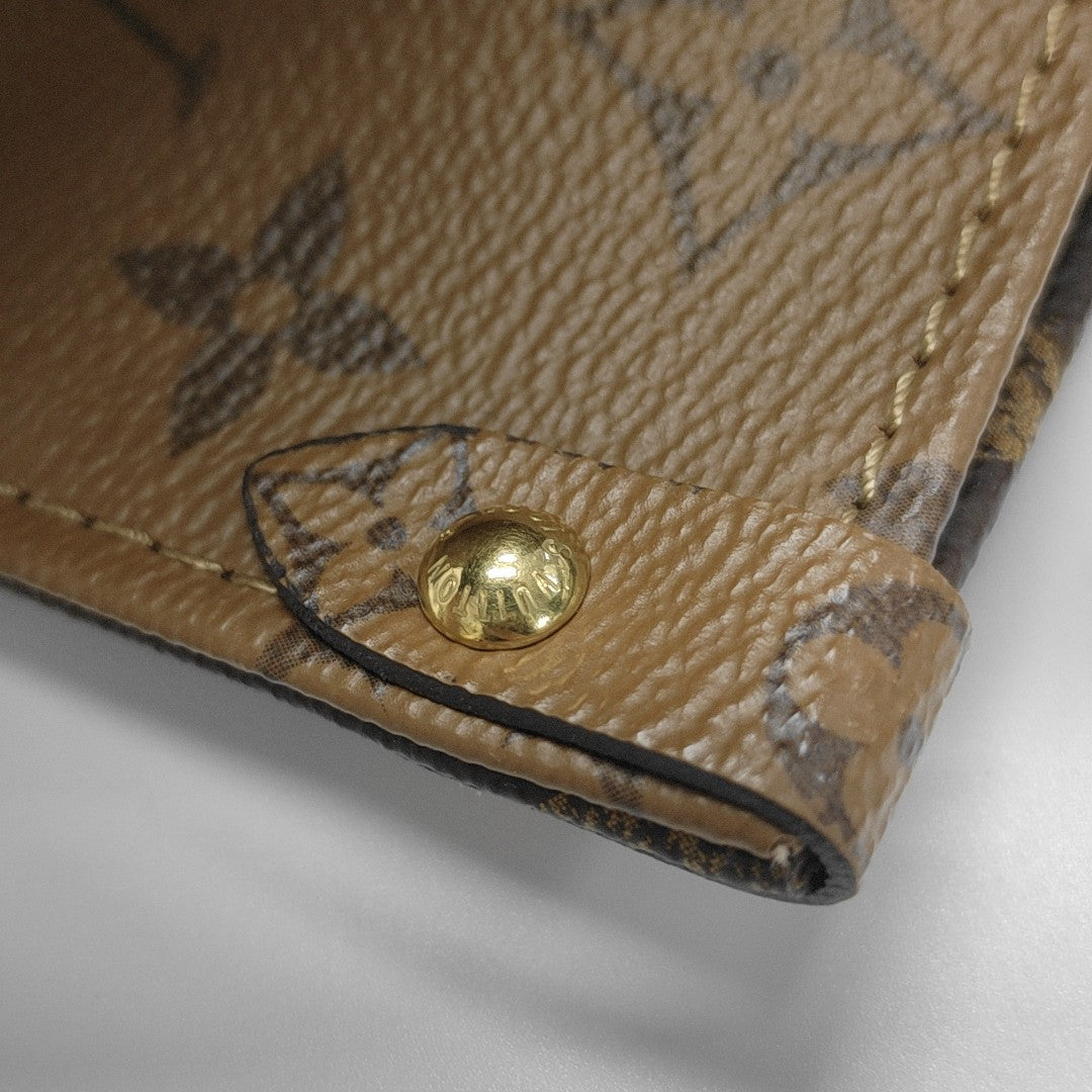 ONTHEGO MM Monogram Coated Canvas Brown