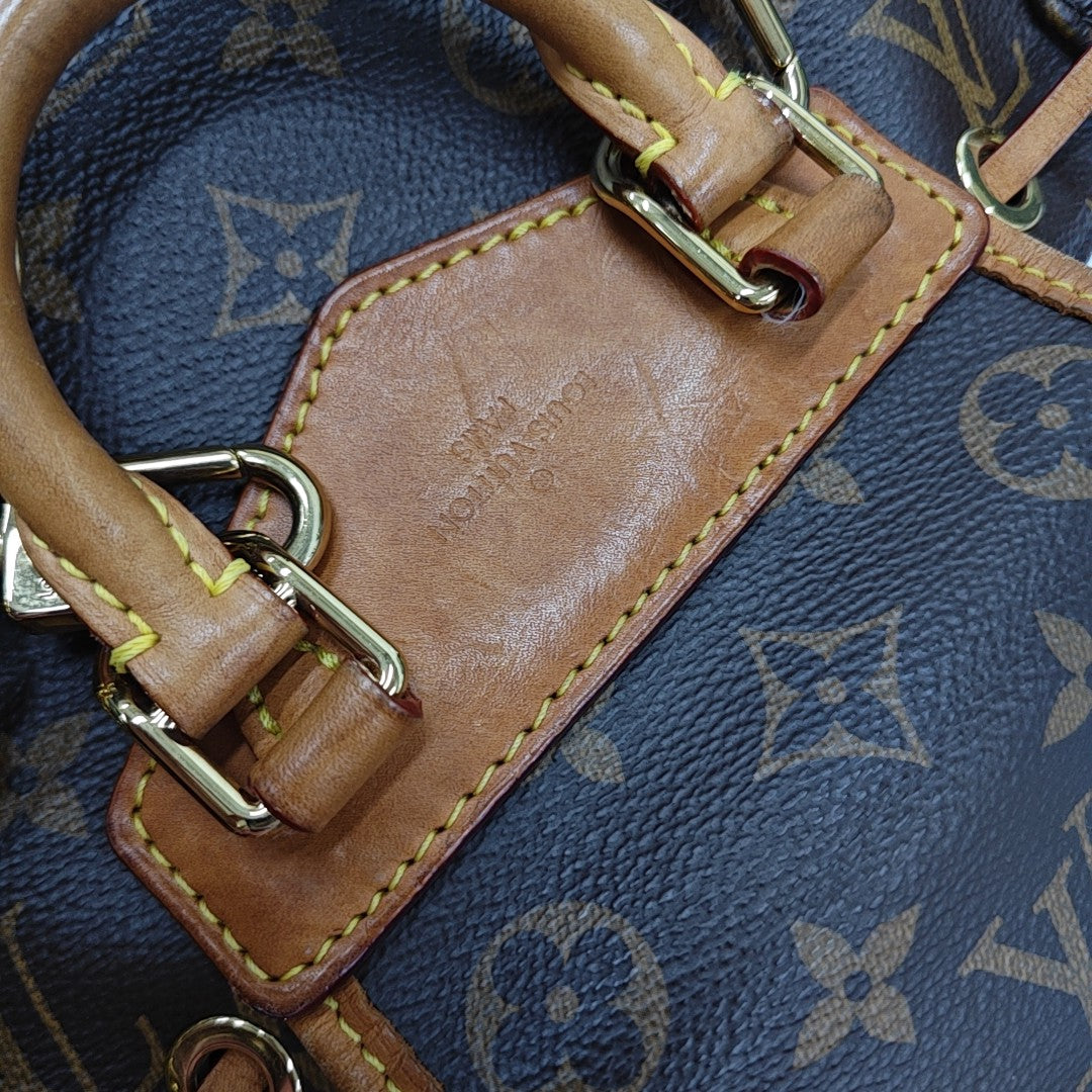 EXCURSION PM Monogram Coated Canvas Brown