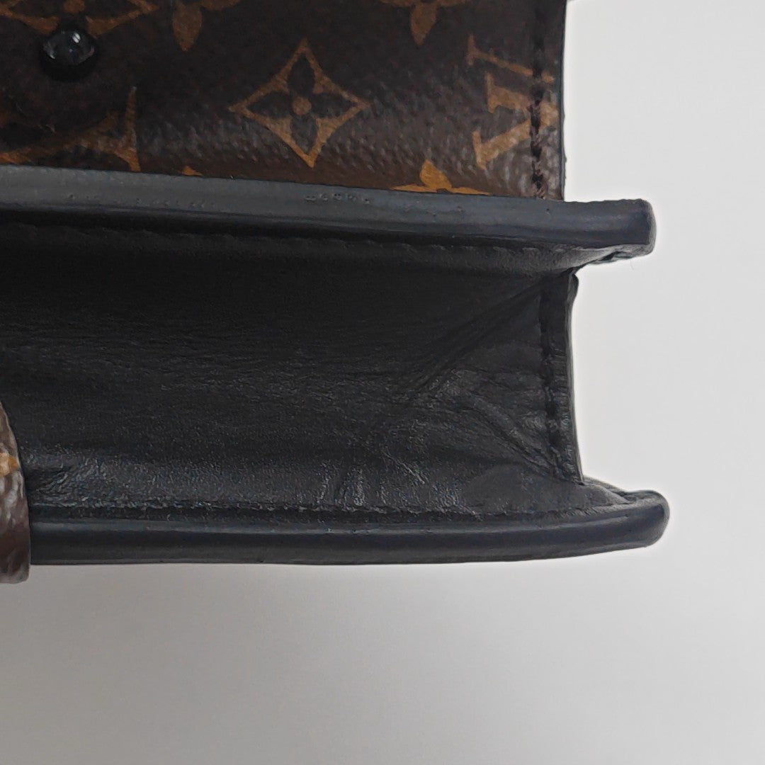 TRUNK Monogram Coated Canvas Brown