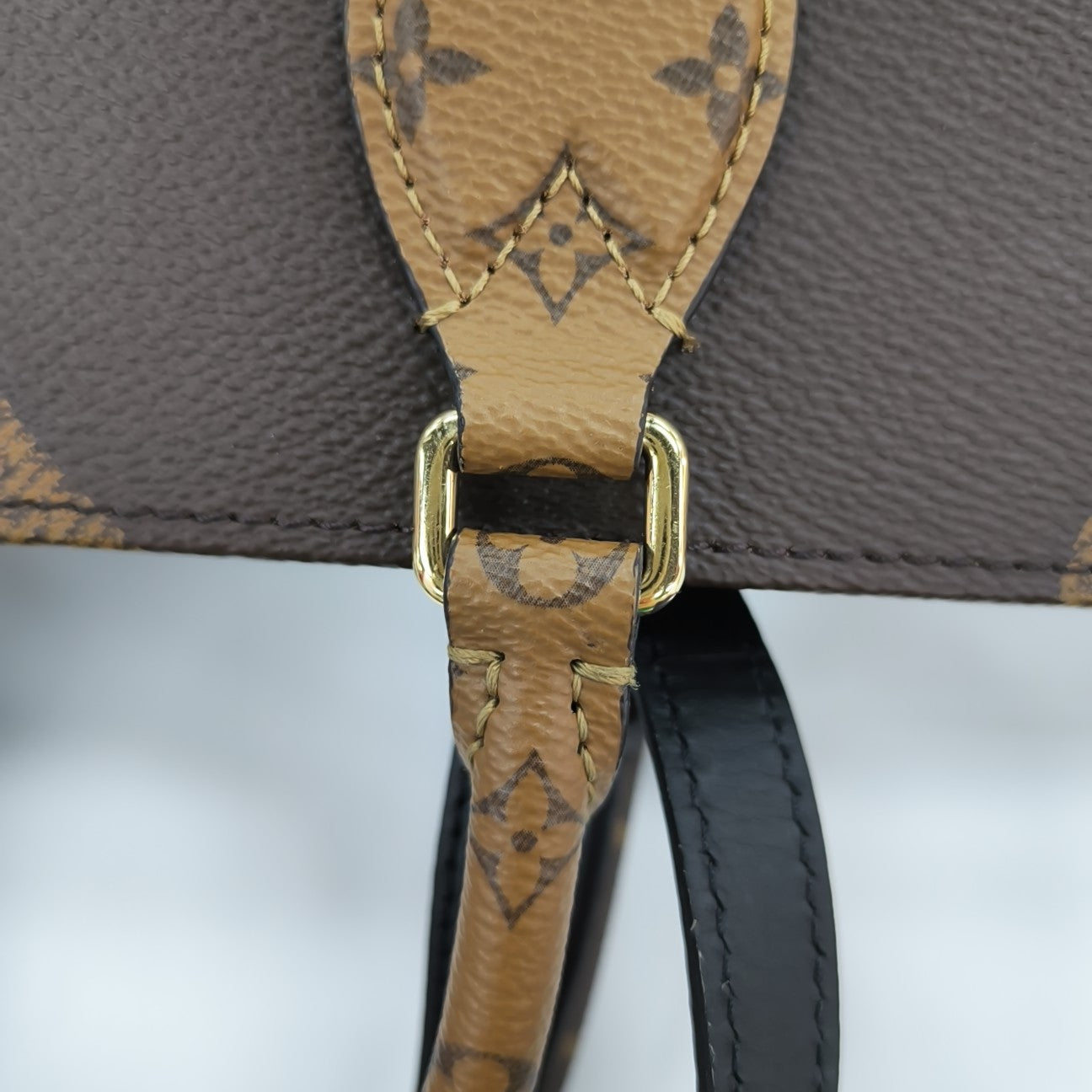 ONTHEGO MM Monogram Coated Canvas Brown
