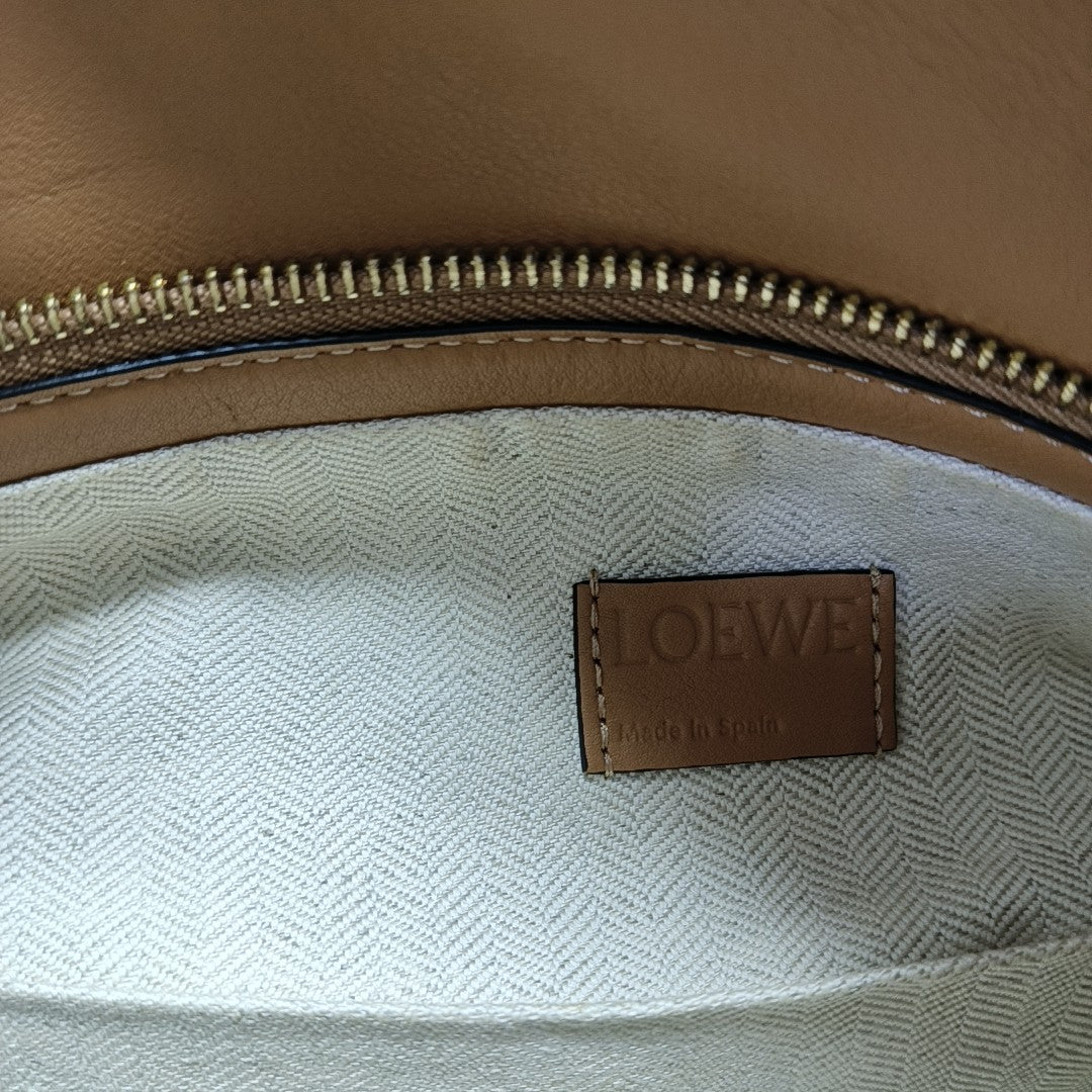 Authenticated pre-owned  Puzzle Hobo Calfskin Brown - Top Handle Bag at Looply