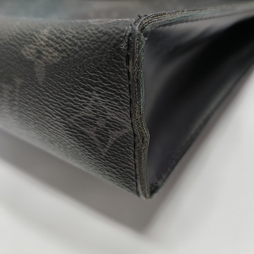 Pochette Voyag MM Monogram Coated Canvas Black