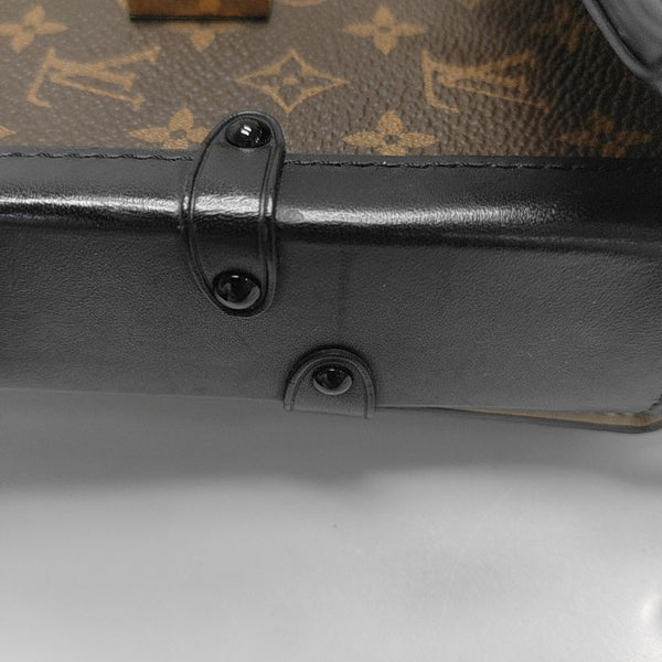 TRUNK Monogram Coated Canvas Brown