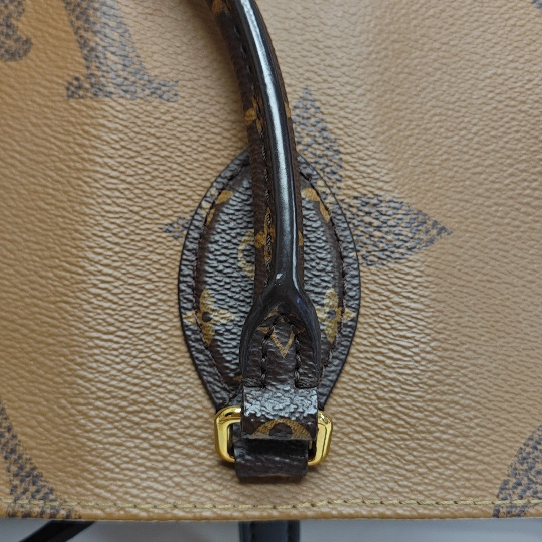 ONTHEGO MM Monogram Coated Canvas Brown