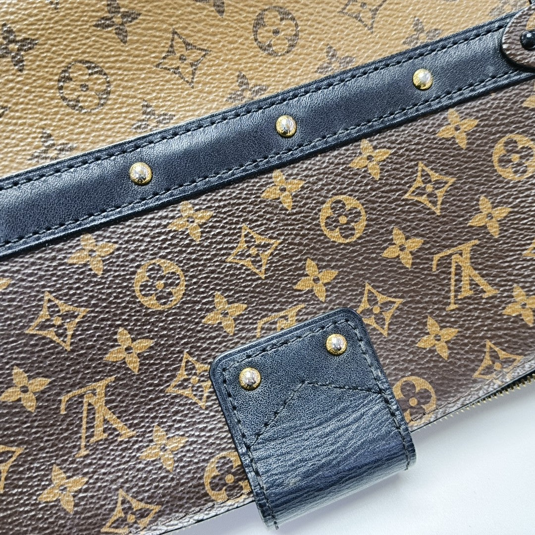 TRUNK Monogram Coated Canvas Brown