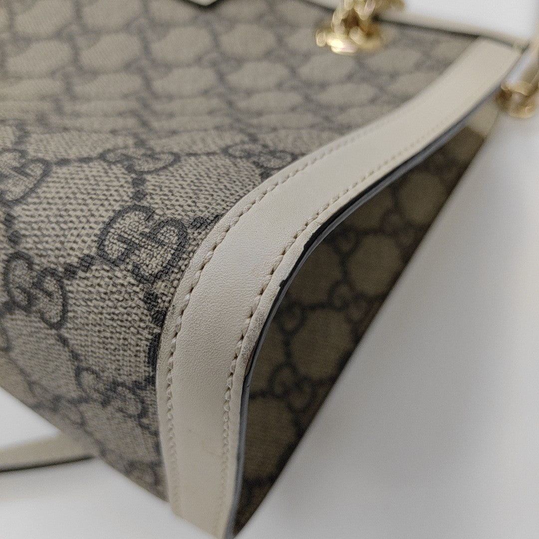 Padlock Small Monogram Coated Canvas Beige