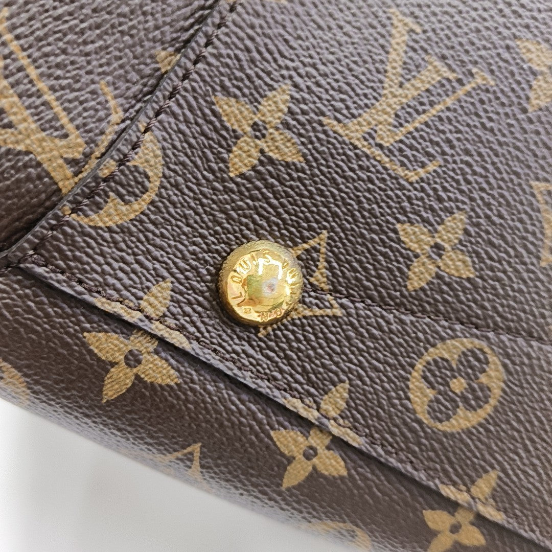 MONTAIGNE GM Monogram Coated Canvas Brown