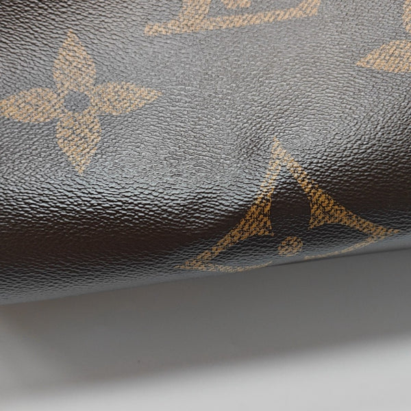 ONTHEGO MM Monogram Coated Canvas Brown