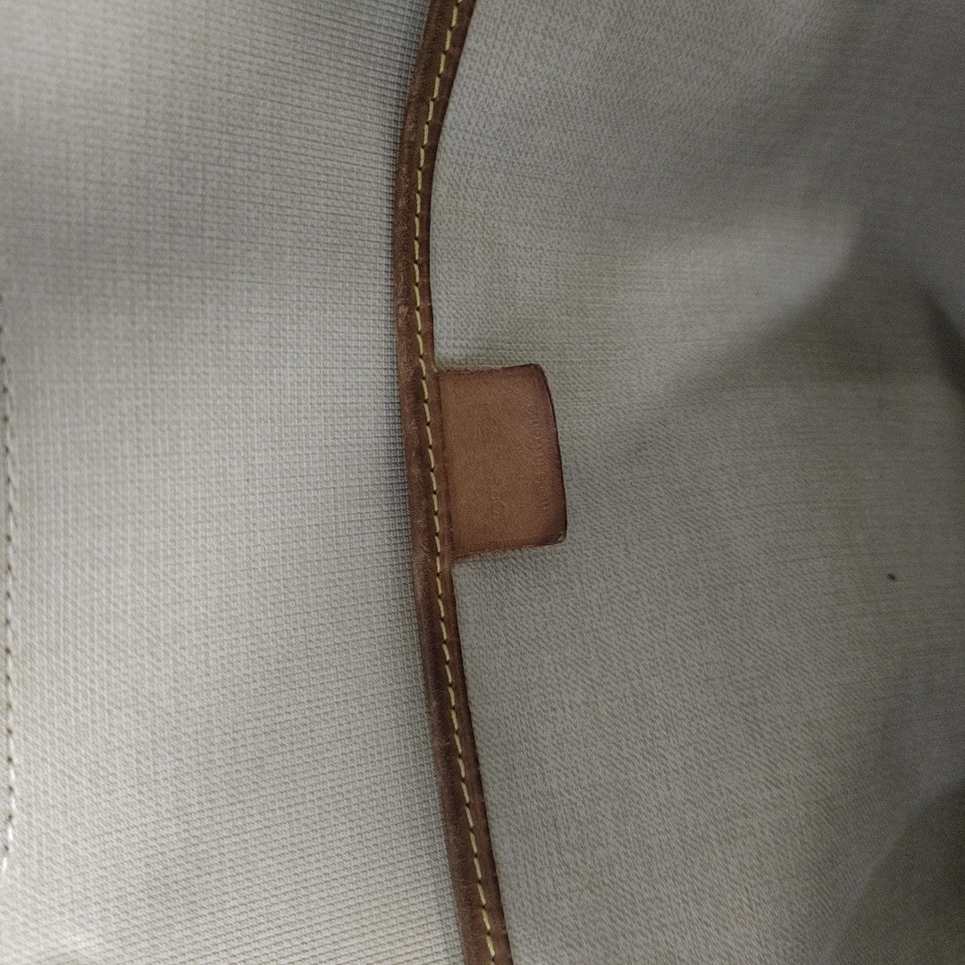 EXCURSION Monogram Coated Canvas Brown