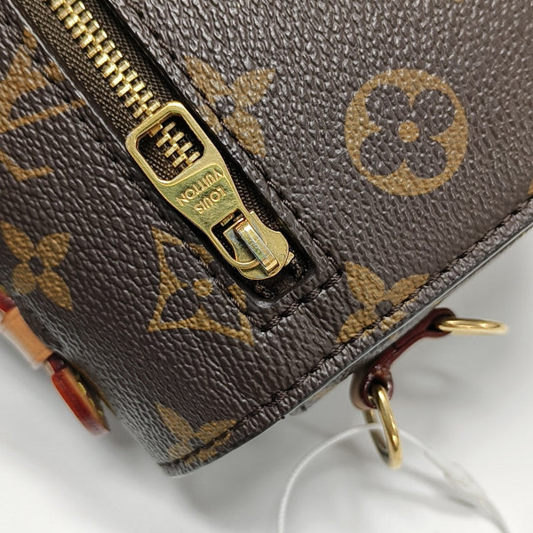 MÉTIS EAST WEST Monogram Coated Canvas Brown