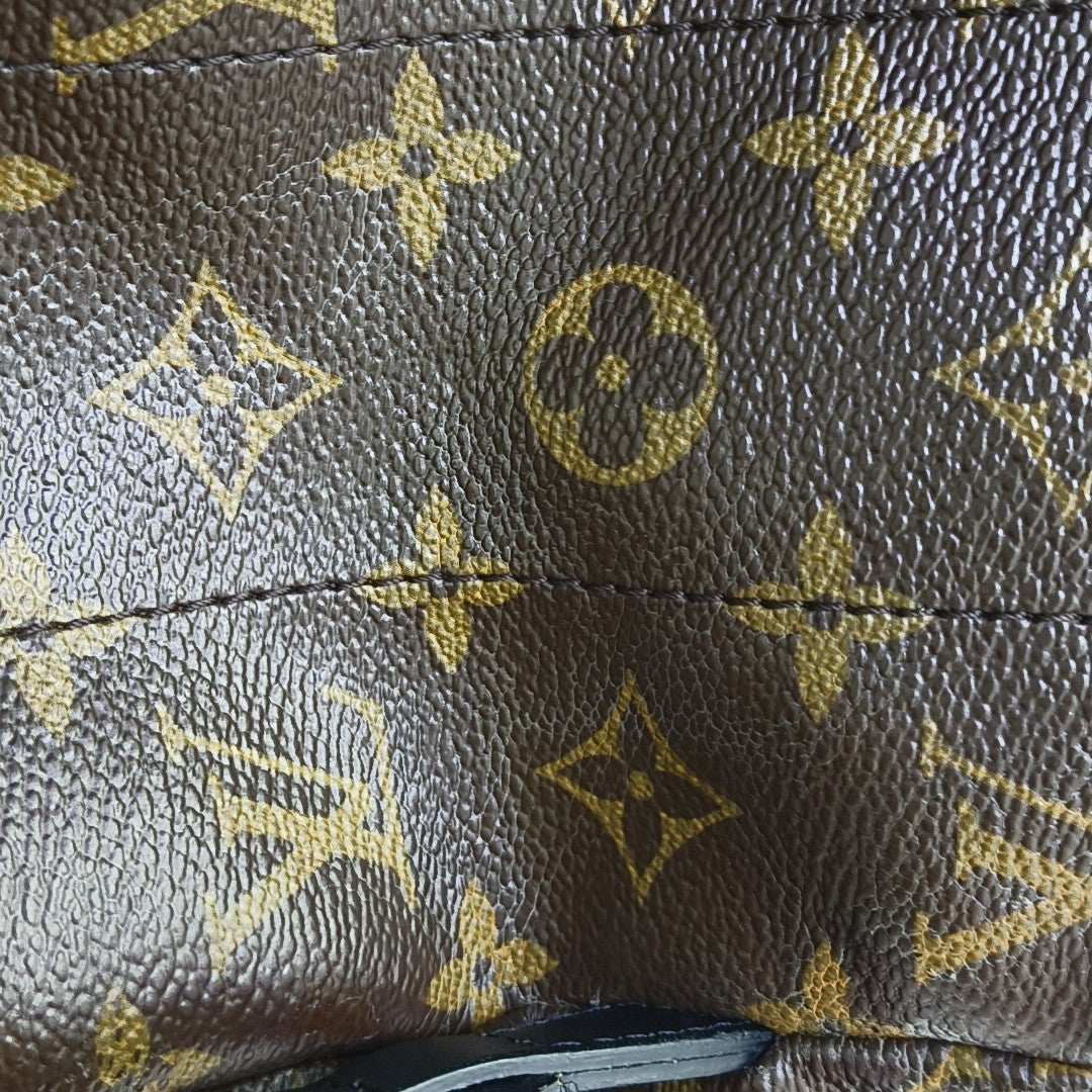 Monogram Coated Canvas Backpack Brown