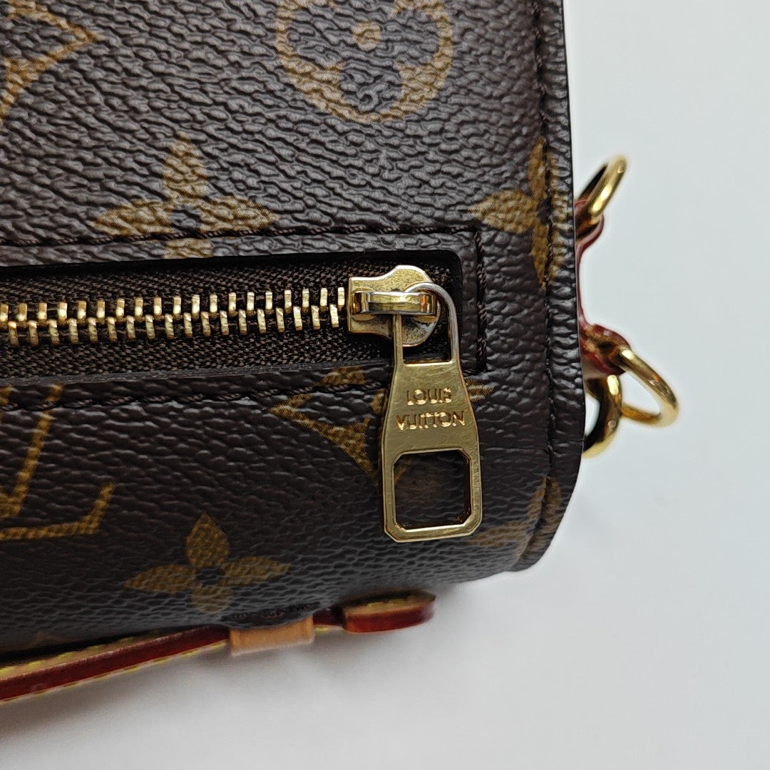 MÉTIS EAST WEST Monogram Coated Canvas Brown