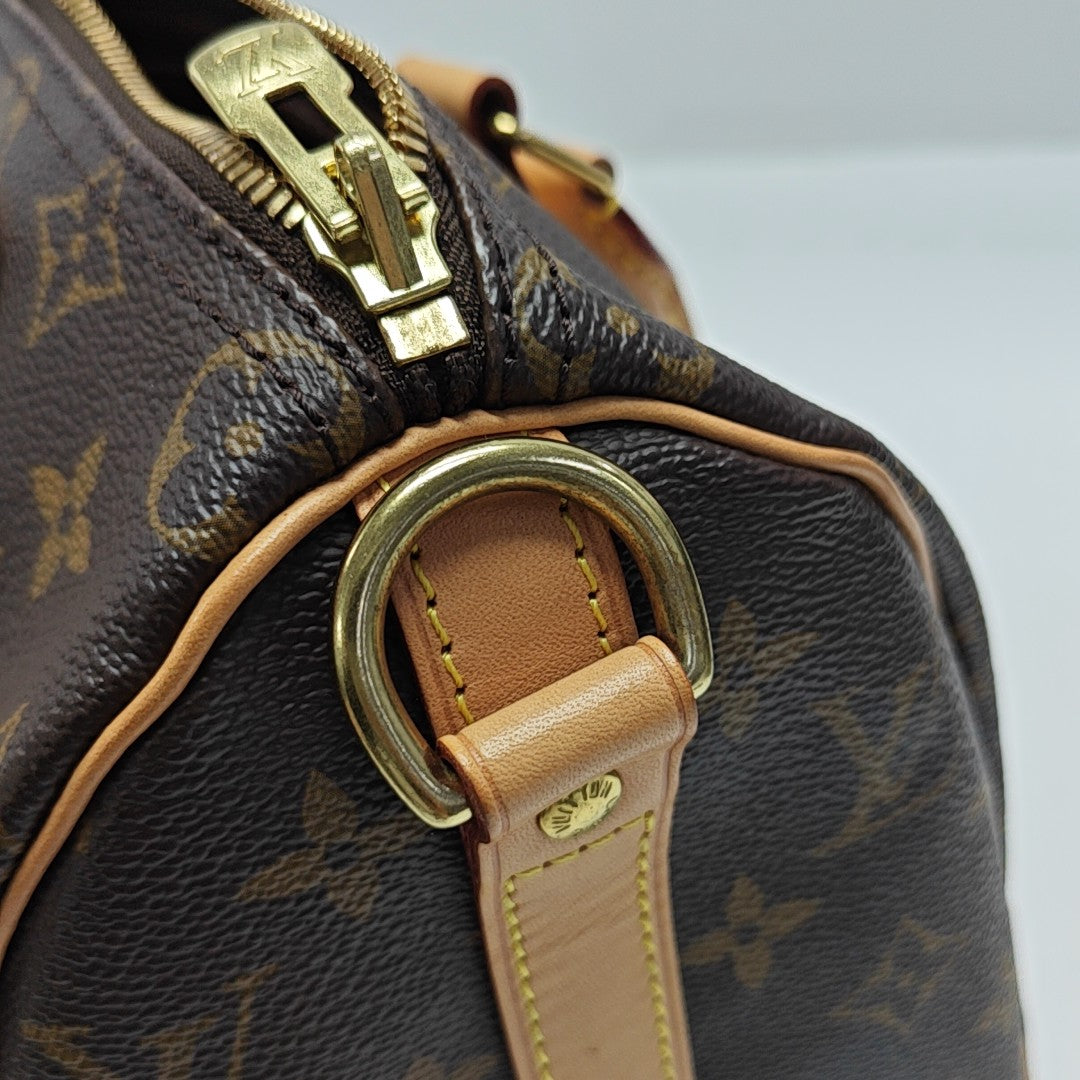 SPEEDY 25 Monogram Coated Canvas Brown
