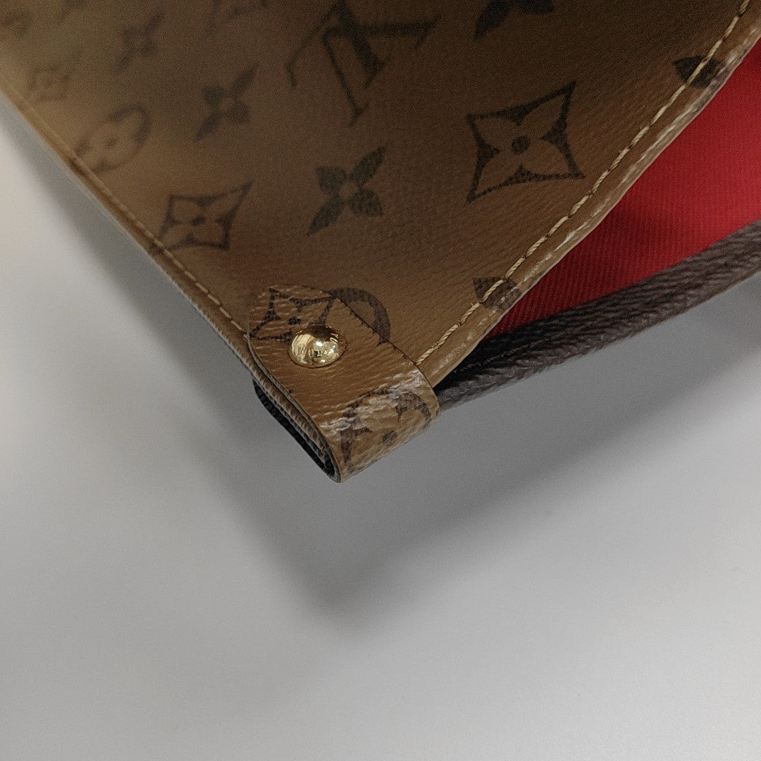 ONTHEGO GM Monogram Coated Canvas Brown