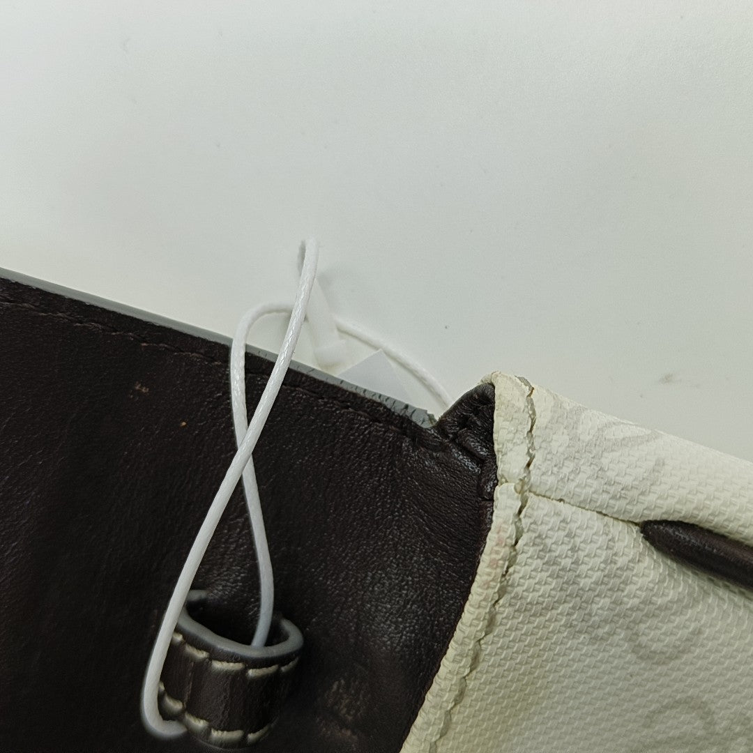 Monogram Coated Canvas Clutch White