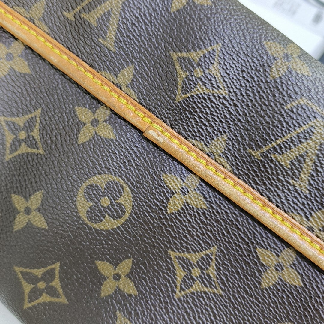 TIKAL Monogram Coated Canvas Brown