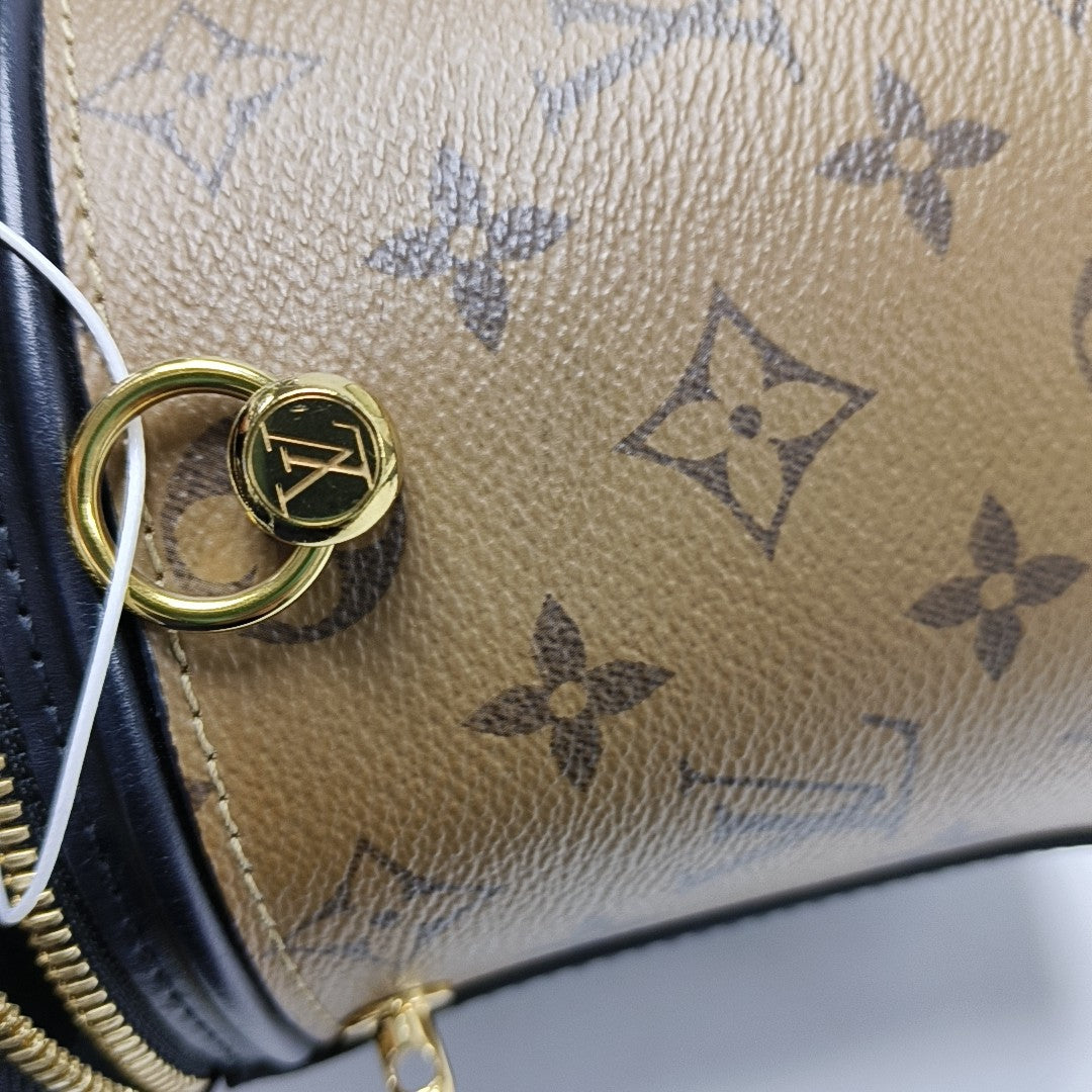CANNES PM Monogram Coated Canvas Brown