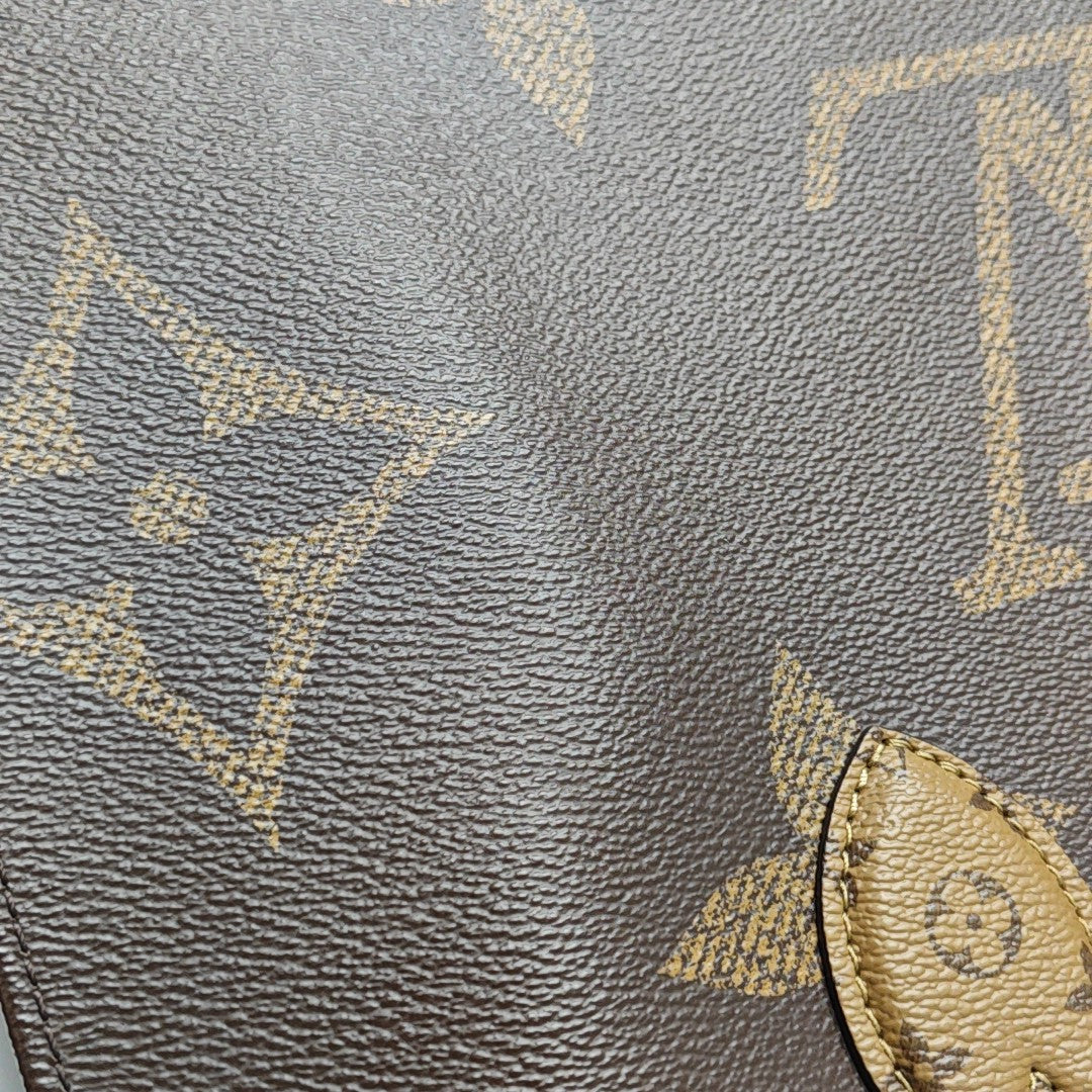 ONTHEGO MM Monogram Coated Canvas Brown