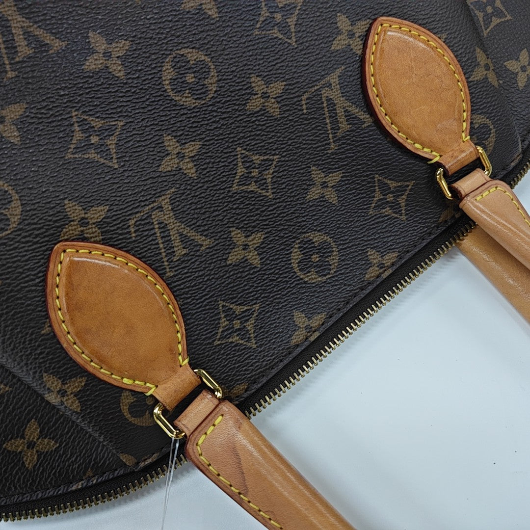 RIVOLI MM Monogram Coated Canvas Brown