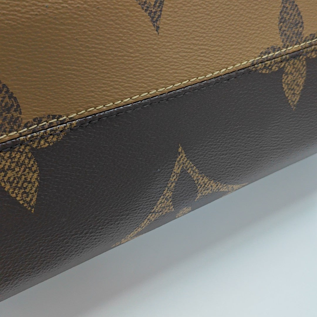 ONTHEGO MM Monogram Coated Canvas Brown